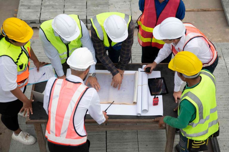 Safety Officers and Workers Conducting Tool Box Meeting